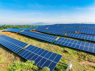 Photovoltaic panels on a hillside at sunrise