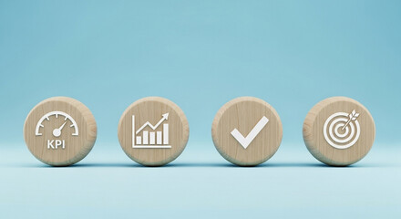 Four wooden discs displaying kpi graph checkmark and target icons on a light blue background surface