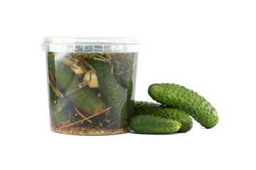 Fresh Pickles in Jar with Organic Ingredients and Cucumbers on White Background