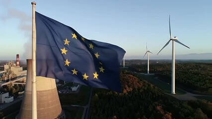 EU Flag Waving Near a Tower Emitting Smoke Plus Wind Turbines on a Hill Generating Renewable Energy With Clear Sky - Powered by Adobe