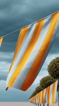 Juneteenth Flag Banner with Bold Orange and White Stripes Hanging Outdoors Along Urban Parade Route - Celebrating Cultural Pride and Community Joy