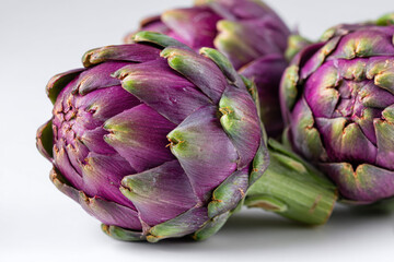 Fototapeta premium Roman artichokes on white studio setting