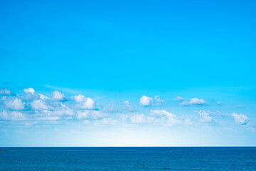 Nature of the ocean and blue sky Summer with sunshine, sandy beaches, clear blue waters sparkling...