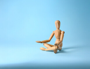 Wooden Figure Sitting Cross-Legged in Meditation Pose – Symbol of Mindfulness, Peace, and Inner Balance