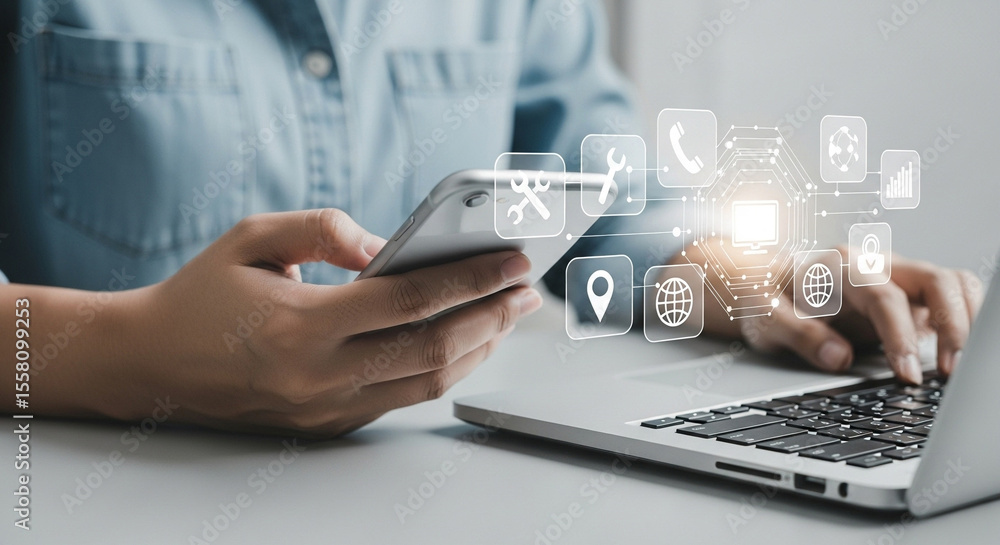 Poster person using laptop and holding smartphone with digital icons floating above the devices