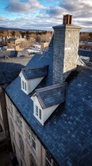 Elegant slate roof with chimney and dormer windows on historic building