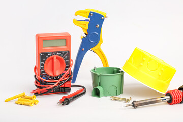Different electrician's tools on light background