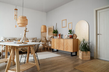 Interior of light room with wind chime and artist's workplace