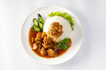 Chicken in brown sauce or gravy sauce with rice  on a white background - Asian food style