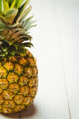 Fresh pineapple on wooden table