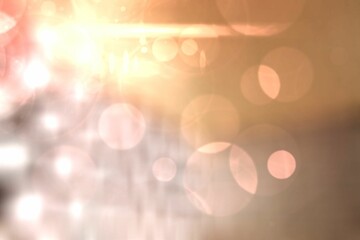 Soft bokeh pattern is filling abstract flat design, with peach amber lens flares