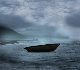 Sail boat on open water in a storm