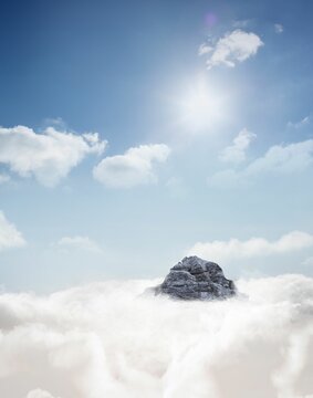 Fototapeta Mountain peak through the clouds