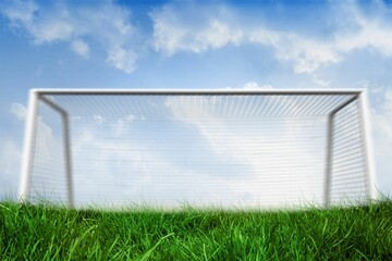 Goalpost on grass under blue sky