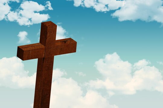 Fototapeta Brown wooden cross is standing in flat style under partly cloudy blue sky with visible grain