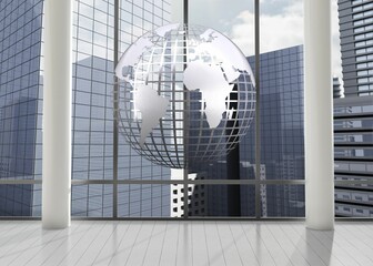 Silver globe floating in room