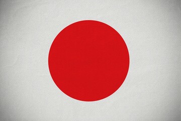 Flat design red circle is resting on textured off-white surface, showing subtle vignette shading