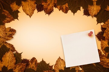 Autumn leaves with yellow note