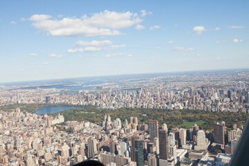 Flat illustration showing New York skyline featuring Central Park lake and skyscrapers
