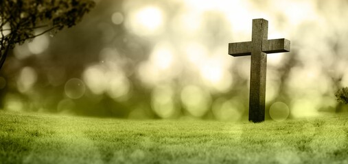 Flat design is showing wooden cross standing in grassy meadow with blurred foliage, bokeh spots