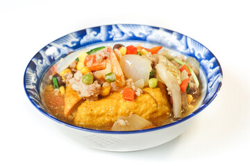 Fried tofu topped with minced pork, shrimp, and nutritious vegetables. An easy to make ancient Chinese dish. Asian food on white background.
