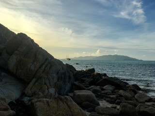 Coastal Serenity at Sunset – Rocky Beach and Calm Ocean at Naturism Beach, Koh Samui, Thailand
