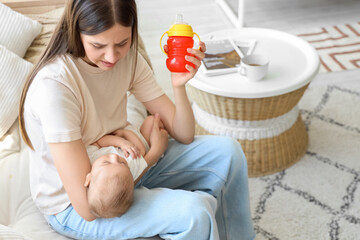 Young mother suffering from postnatal depression at home