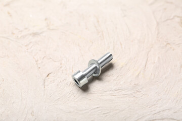 Tap bolt with washer on white grunge background