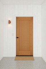 Modern interior hallway featuring a warm oak shaker style door with a black lever handle and a copper wall sconce illuminating vertical white paneling