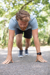 male runner in starting blocks