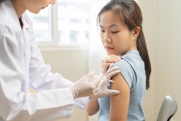 Health care, corona virus, sick asian young woman patient, nurse giving syringe vaccine, injection...