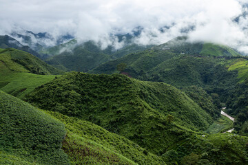 Landscape of Morning Mist with Mountain Layer. mountain ridge and clouds in rural jungle bush forest