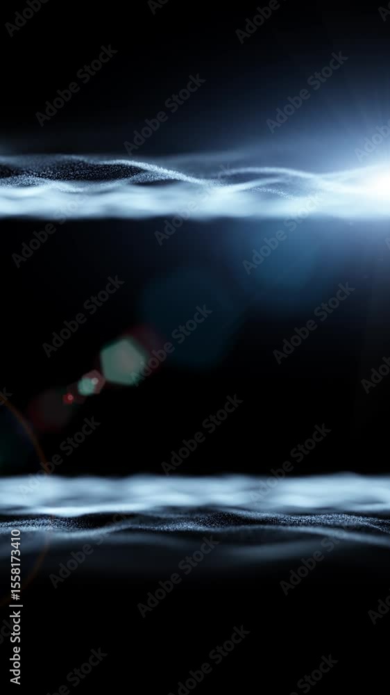 Poster artistic loop sea waves with lens flare on black copy space vertical background.