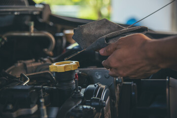 Close up Man hands fixing Car machinery vehicle mechanical service. Mechanic man hands repairing car auto repair shop. open vehicle hood checking up auto mobile. Vehicle Car maintenance engineer.