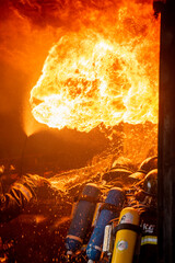 Vertical Horizon Firefighter Rescue training in fire fighting extinguisher. Firefighter fighting...