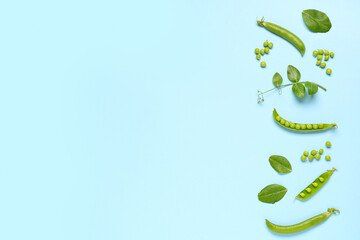 Fresh green peas and leaves on blue background