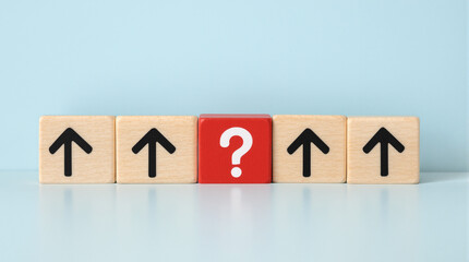 wooden blocks , upwaed pointing arrow . A red ablock with a question mask .