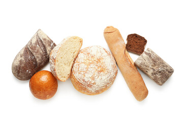Loaves of different fresh bread isolated on white background