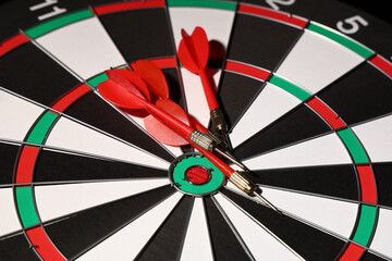 Board with darts, closeup view