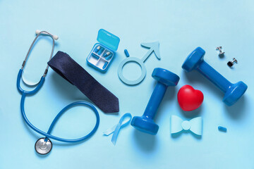 Male sign with heart, pills and male accessories on blue background. Prostate cancer awareness...
