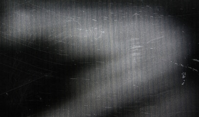textured grayscale surface with abstract blurred tree silhouettes creating a subtle moody...