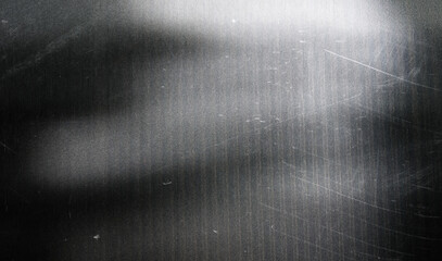 textured grayscale surface with abstract blurred tree silhouettes creating a subtle moody...