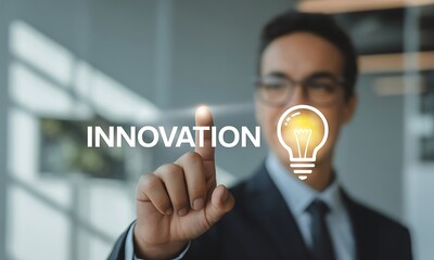 businessman pointing at innovation text in office setting