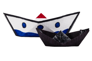 Paper boats on white background