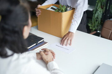 Business man sending resignation letter to boss and Holding Stuff Resign Depress or carrying...