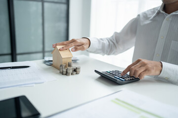 Saving money for Real estate investment with with stack of money coins for buying home and loan for...
