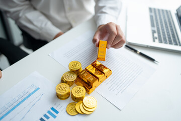Gold bar Trading business people hand offering gold Investment in gold mining company or Trading...