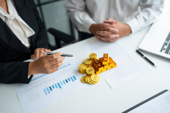 Gold bar Trading business people hand offering gold Investment in gold mining company or Trading gold on the stock exchange Rising prices