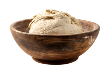 Raw bread dough piled high in a rustic wooden bowl with flour dusting isolated on transparent background