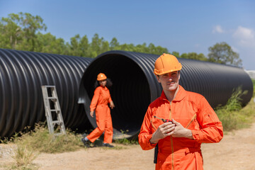 Industry Engineers Walking Inside Circular water Pipe. Engineering or Worker inspection pipe...